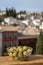 Glass bowl with green andalusian olives served on outdoor terrace with view on old part of Granada, Andalusia, Spain