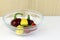 Glass bowl of ornamental peppers