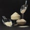 In glass bowls coconut flour and psyllium, scoops are filled with bulk products. Low-carb baking ingredients. Keto shop