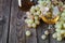 Glass of brandy with brush of grapes on table, harvest holiday