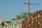 Glass and brick buildings with red crane