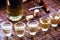 Glass of cachaÃ§a, in a rustic setting. CachaÃ§a or pinga, Brazilian drink from sugar cane. Rustic bar setting, Brazilian still