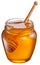 Glass can full of honey and wooden stick in it.