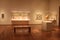 Glass cases and pedestals, with soft lights on various artifacts, Cleveland Art Museum, Ohio, 2016