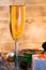 A glass of champagne.Bubbly. A goblet of Sparkling wine. A wineglass of Fizz. Christmas background. A candle champagne