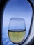 Glass of champagne in front of aircraft window-stock photos