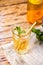 The glass of citrus iced tea on a marble tray and wooden table.