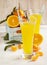 Glass of Citrus juice and fresh oranges and mandarines