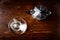 Glass coffee cup and vintage coffeepot on dark wooden table