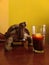 a glass of coffee and a turtle on a wooden table with wallpaper background