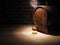 Glass of cognac with barrel on wooden table