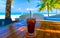 A glass of cold cocktail on a table on the beach in a restaurant. Maldives