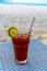 A glass of cold cocktail on a table on the beach in a restaurant. Maldives