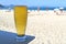 Glass of cold draft beer against sunny Copacabana beach in Rio de Janeiro, Brazil, South America