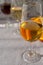 Glass with cold fino sherry fortified wine in sunlights, andalusian style interior on background