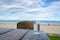 Glass of cold mineral water on the table of the beach background