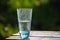 Glass of cold mineral water on the table outdoor