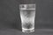 A glass of cold water, covered with settled vapors and dust particles 0087