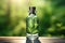 Glass cosmetic bottle in summer forest with leaves background