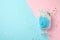 Glass with cotton candy  macaroon on color background, top view. Space for text