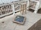 Glass covering over historical boundary marker with wood chair in Virginia