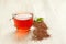 Glass cup of healthy natural herbal rooibos tea on