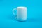 Glass cup isolated on a blue background. Dishes for drinks. Food concept