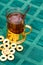 Glass cup of tea in an aluminum cup holder with fragrant green bagels