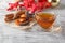 Glass cup of tea with anise, cinnamon and citrus fruits winter d