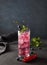 Glass currant berry water dark background blueberry coctail cold fresh drink splash