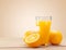 Glass of delicious orange juice on wooden table