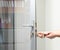 Glass Door knob repairing , worker Installs door knob, woodworker hands close-up