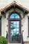 Glass door and transom reflecting the sky