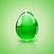 Glass Easter egg on green background