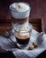 Glass of Espresso Macchiato and Latte Macchiato with Brown Sugar