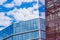 Glass Facade of Violet Tinted Semi-Transparent Glass Building Against Blue Sky with Sunbeams