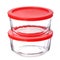 Glass food containers with red plastic lids isolated on white