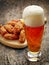 Glass of fresh beer and fried chicken wings