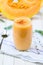 Glass of fresh cantaloupe smoothie