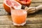 Glass of fresh organic pink grapefruit juice