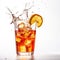 Glass of fruit tea with a splash on a plain white backg - product photography