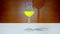 Glass goblet fills with yellow liquid