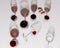 Glass goblets with red wine, different shapes stand on a white stone background