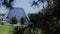 Glass greenhouse in a botanical garden in summer