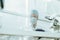 through the glass. group of scientists in protective masks work in the laboratory.