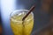 Glass of healthy herbal iced tea with brown plastic straw
