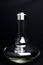 Glass hookah Flask with water drops on a black background.