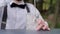 Glass with ice on bar counter, barman stirring ice bar spoon close-up, bartender makes cooling beverage to fresh air