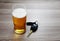 Glass of ice cold beer and car keys./Dont Drink and Drive./Drinking beer and holding