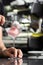 glass of ice cream scoops, top view with copy space. Barmen Pouring Scoop of berries Ice Cream on gray background